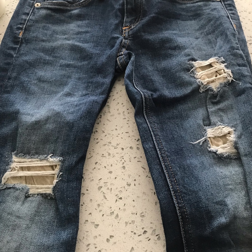Rag and Bone jeans with rips, gold underlining